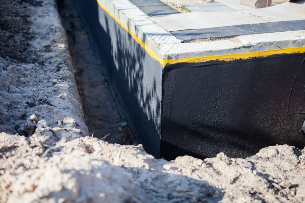 Professional Waterproofing technician working in Fayetteville, TN